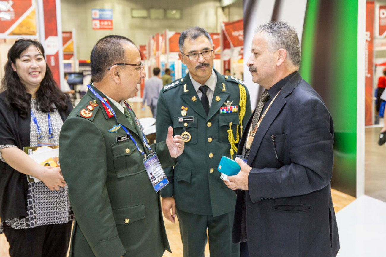 Defence officials networking at an exhibition